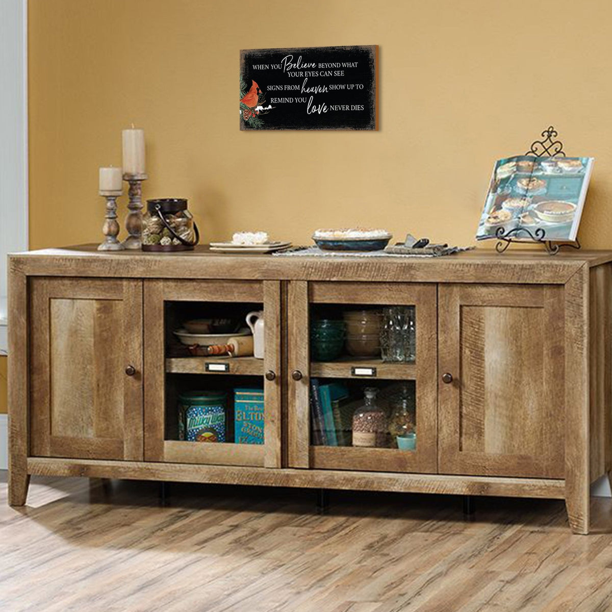 A wooden memorial wall plaque featuring a cardinal, a symbol of remembrance and love.