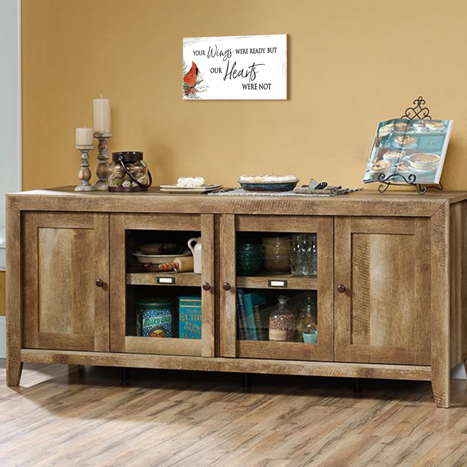 A wooden memorial wall plaque featuring a cardinal, a symbol of remembrance and love.