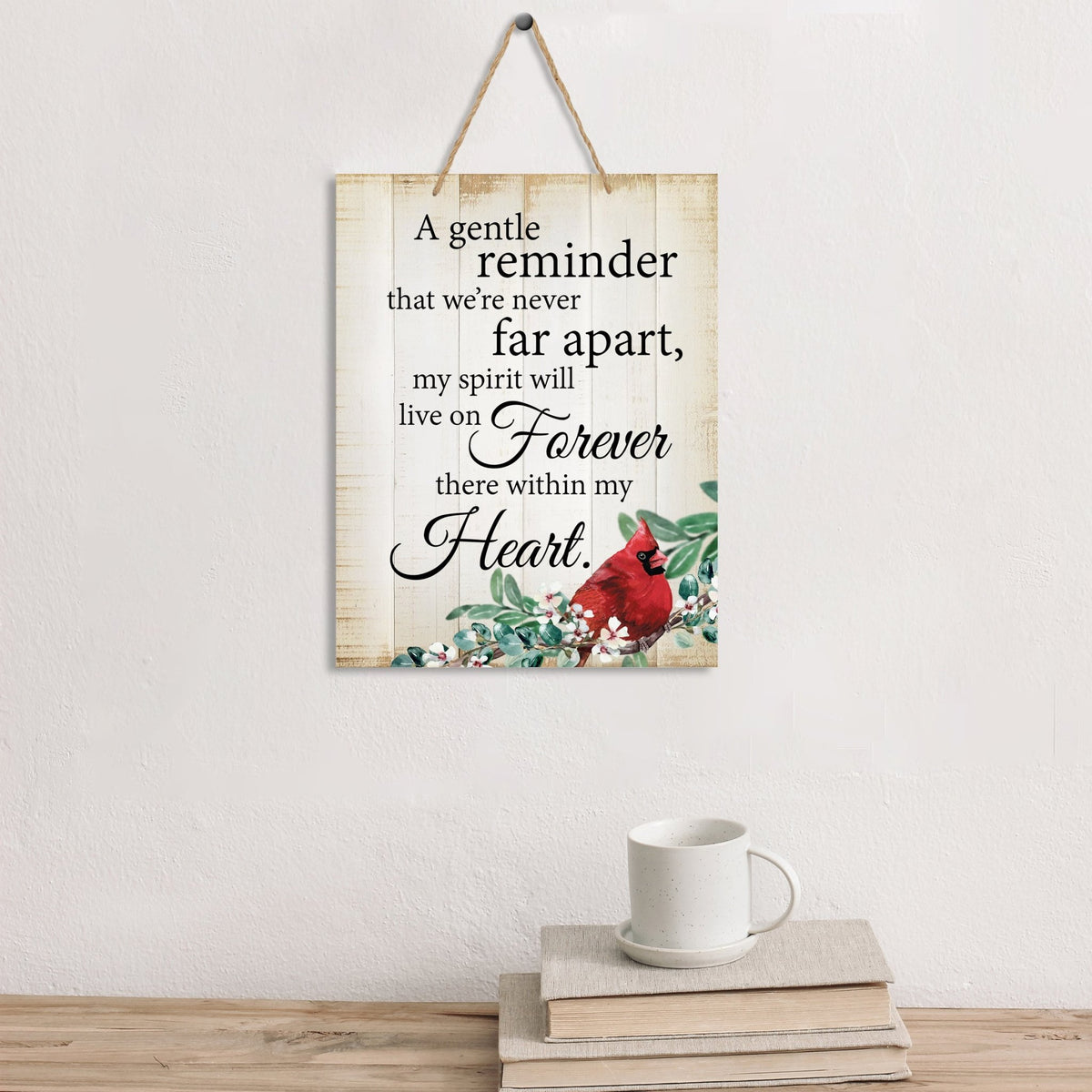 Thoughtful memorial gifts for the loss of a loved one – a wooden hanging sign adorned with a cardinal ribbon.
