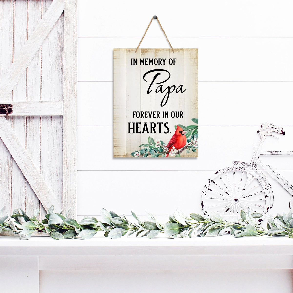 Thoughtful memorial gifts for the loss of a loved one – a wooden hanging sign adorned with a cardinal ribbon.