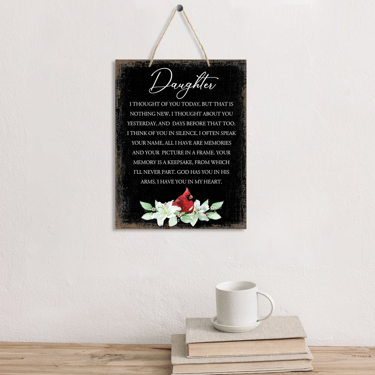 Thoughtful memorial gifts for the loss of a loved one – a wooden hanging sign adorned with a cardinal ribbon.