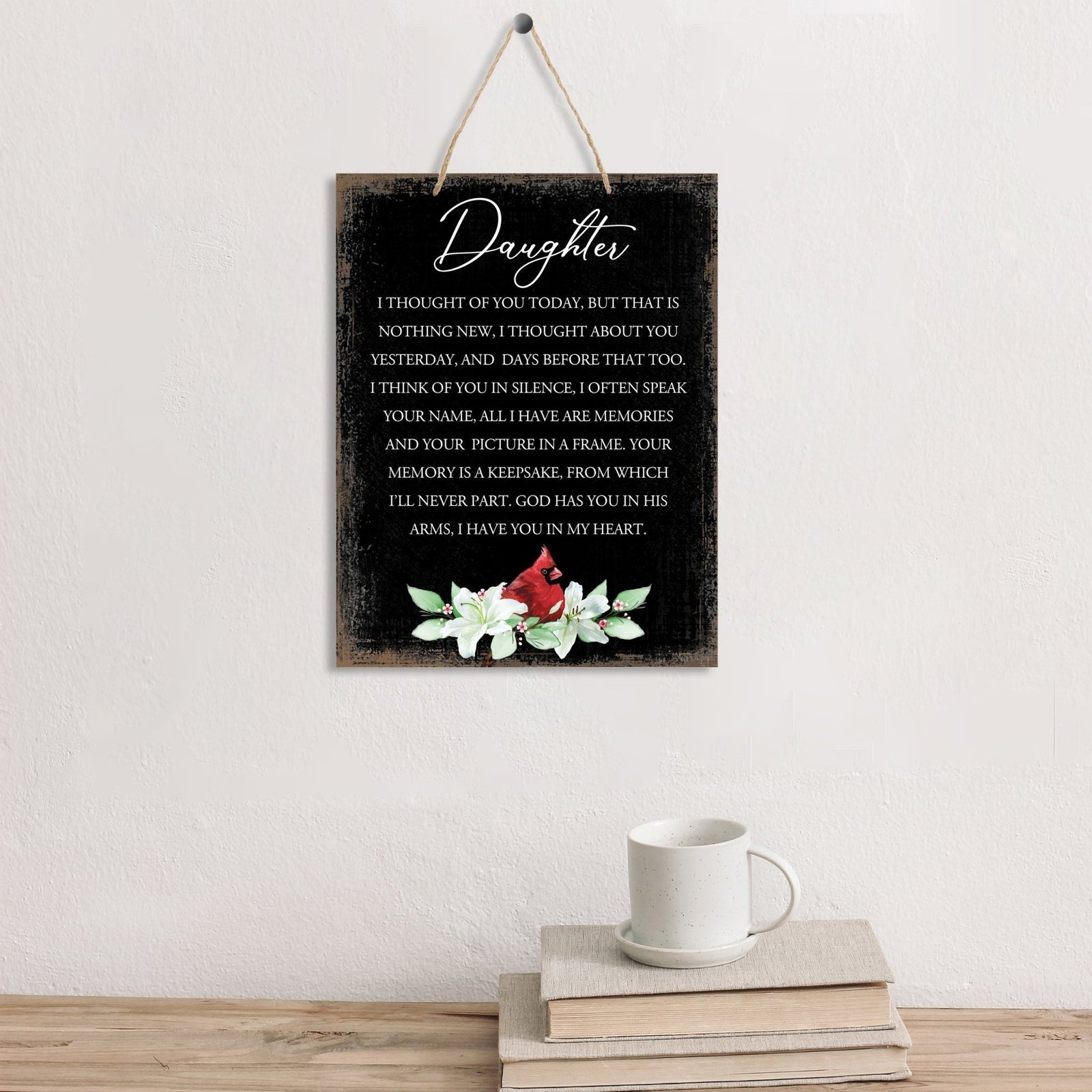 Thoughtful memorial gifts for the loss of a loved one – a wooden hanging sign adorned with a cardinal ribbon.