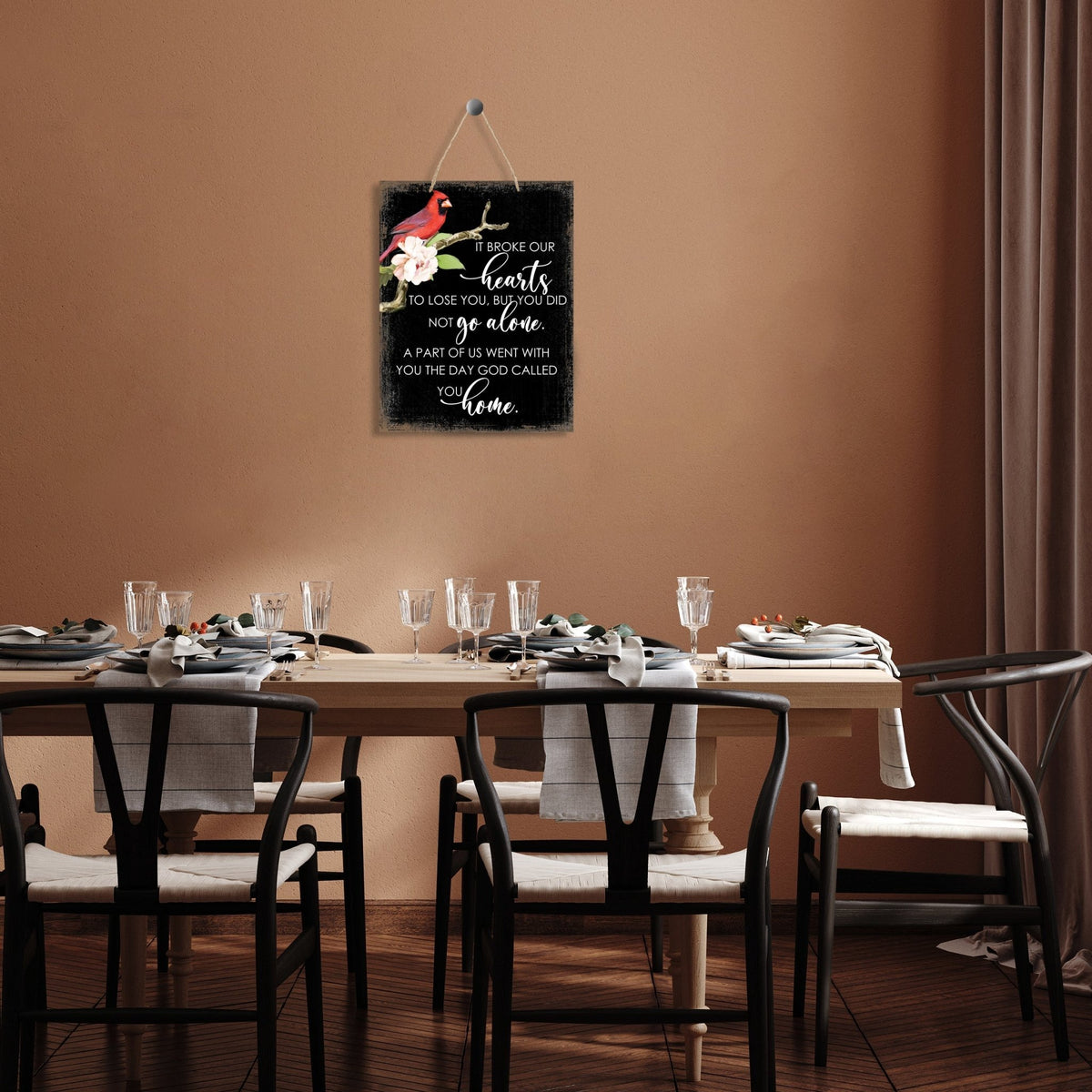 Thoughtful memorial gifts for the loss of a loved one – a wooden hanging sign adorned with a cardinal ribbon.
