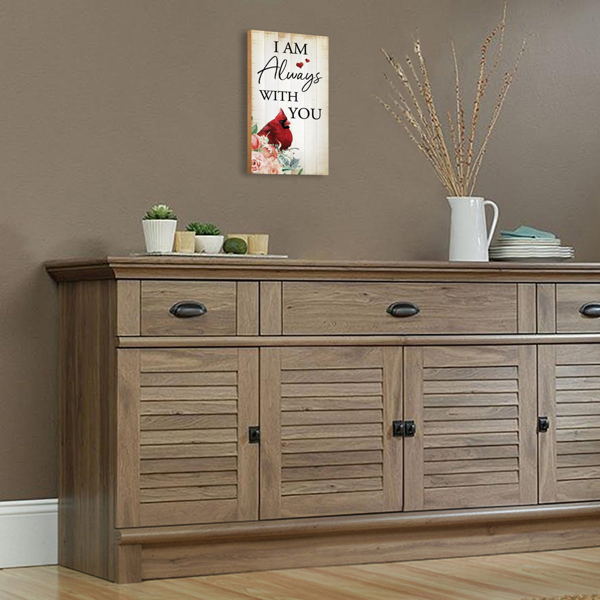 A wooden memorial wall plaque featuring a cardinal, a symbol of remembrance and love.