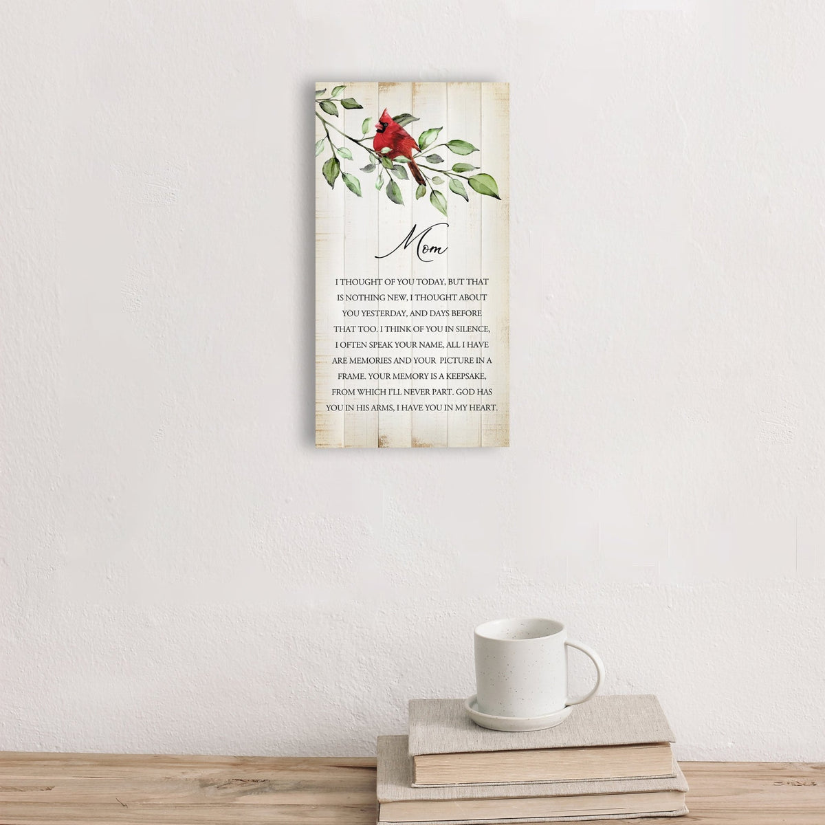 A wooden memorial wall plaque featuring a cardinal, a symbol of remembrance and love.