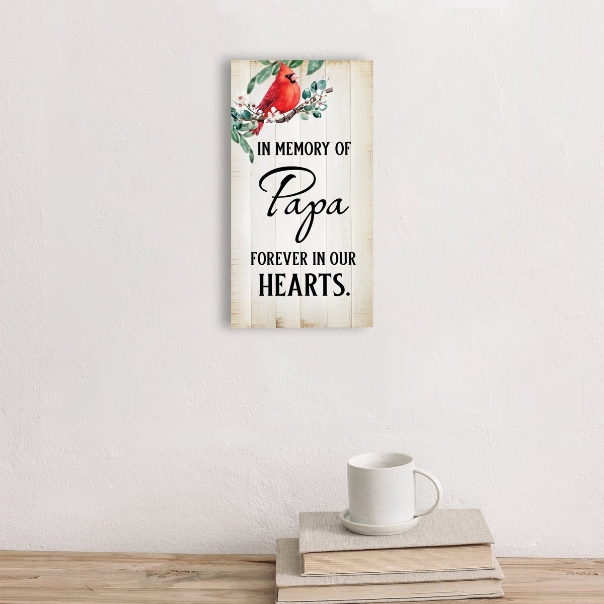 A wooden memorial wall plaque featuring a cardinal, a symbol of remembrance and love.