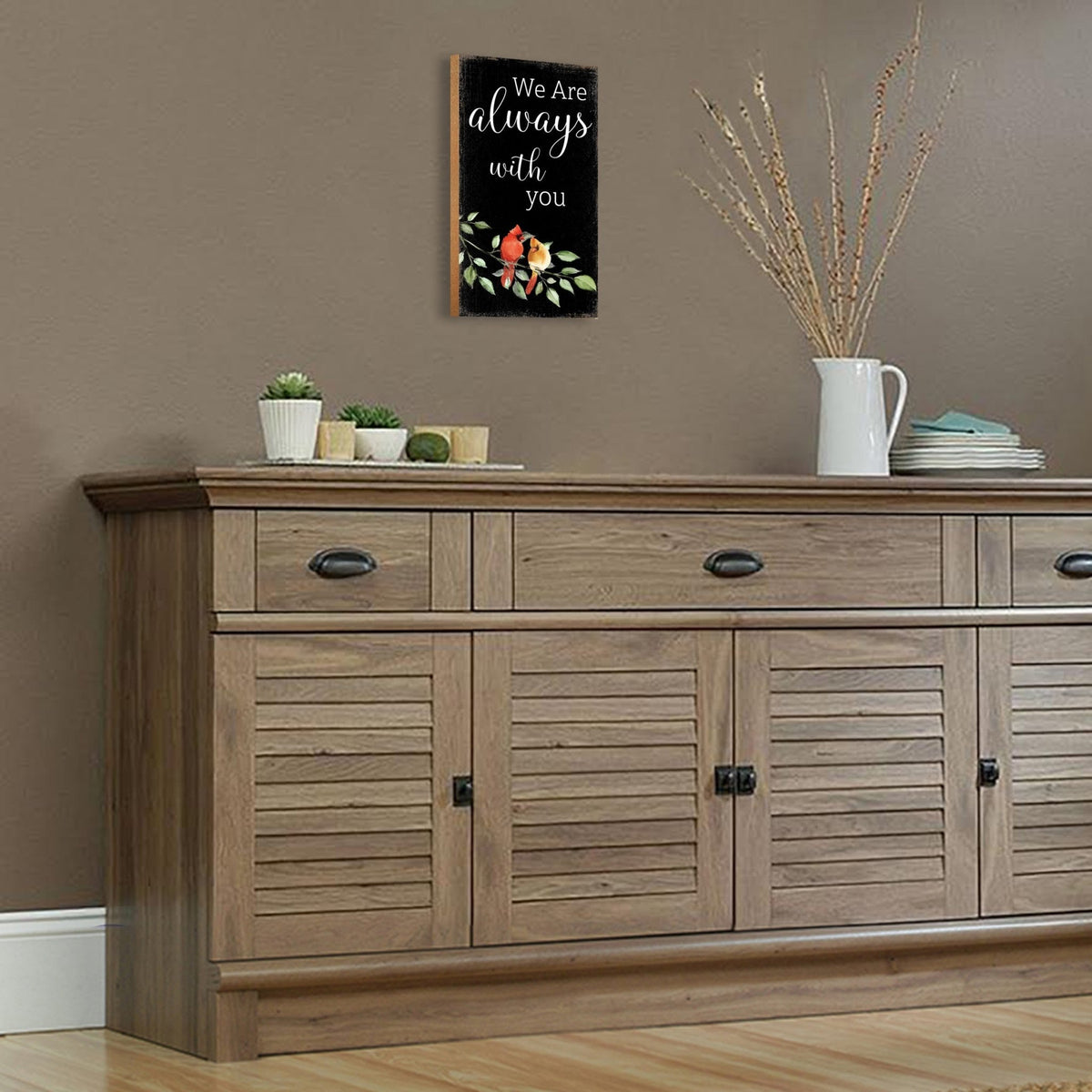 A wooden memorial wall plaque featuring a cardinal, a symbol of remembrance and love.