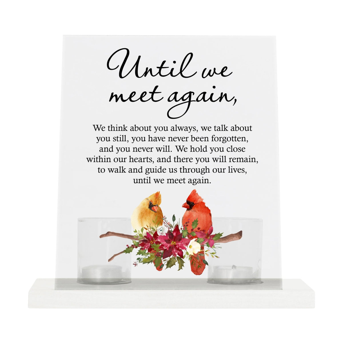 A solemn memorial display featuring a Lifesong Milestones Cardinal Memorial Frosted Acrylic Sign with Base and Votive Candle Holder. The tealight candle holder provides a warm glow, while votive candles surround it, creating a touching memory.