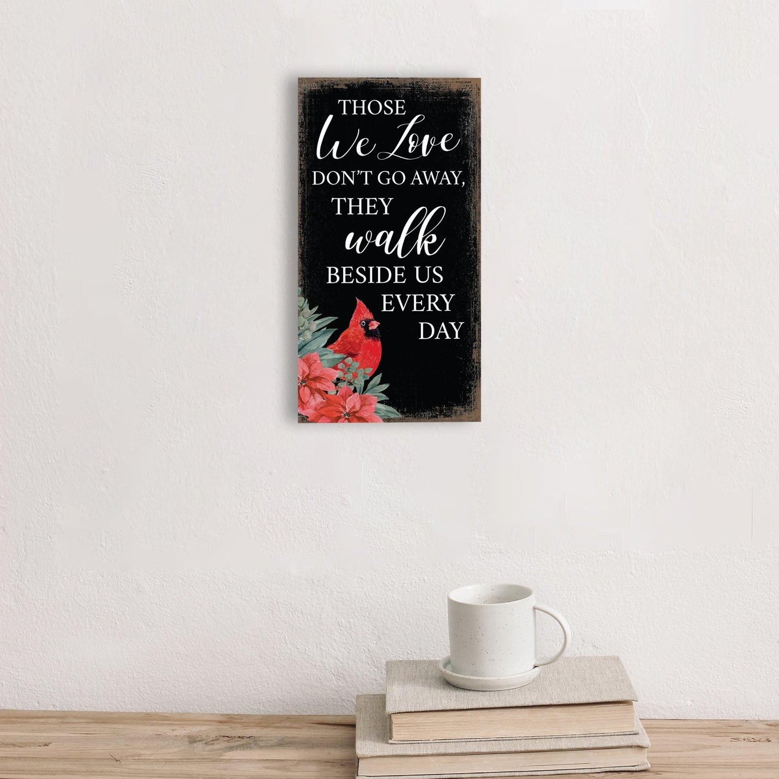 A wooden memorial wall plaque featuring a cardinal, a symbol of remembrance and love.