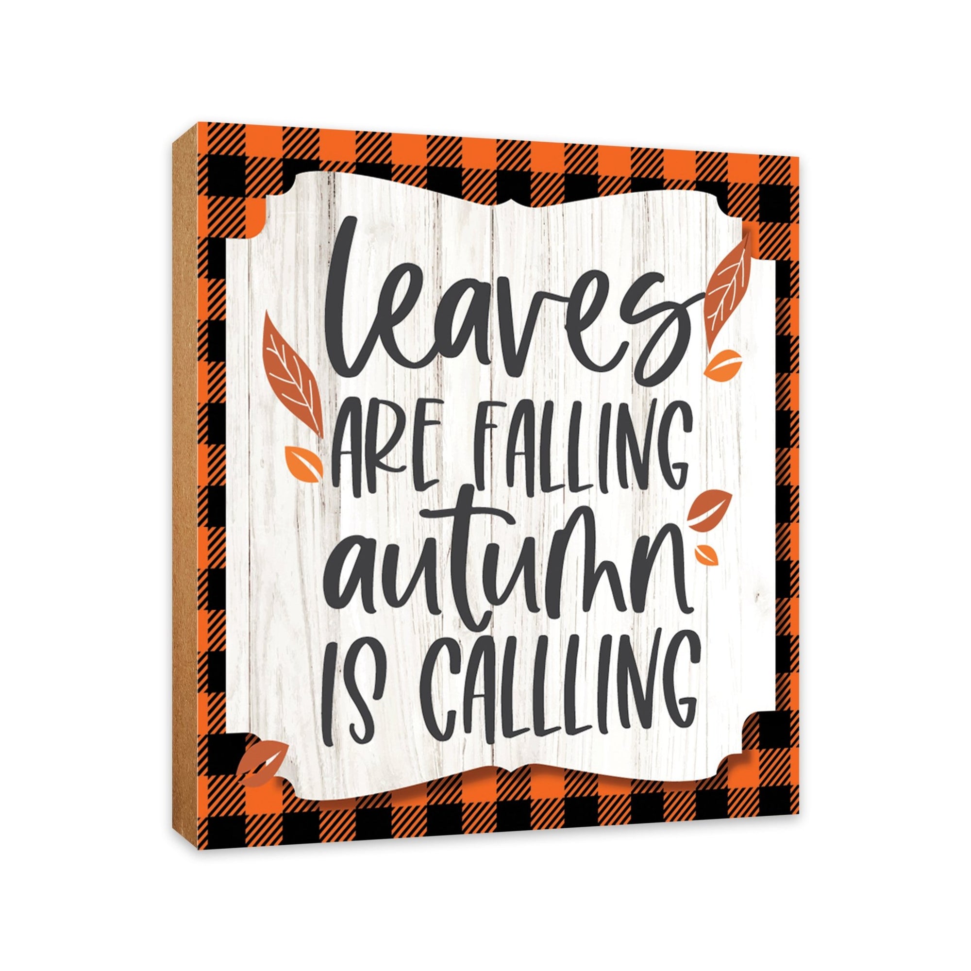 A close-up of a wooden tabletop adorned with inspirational fall signs, enhancing your home decor
