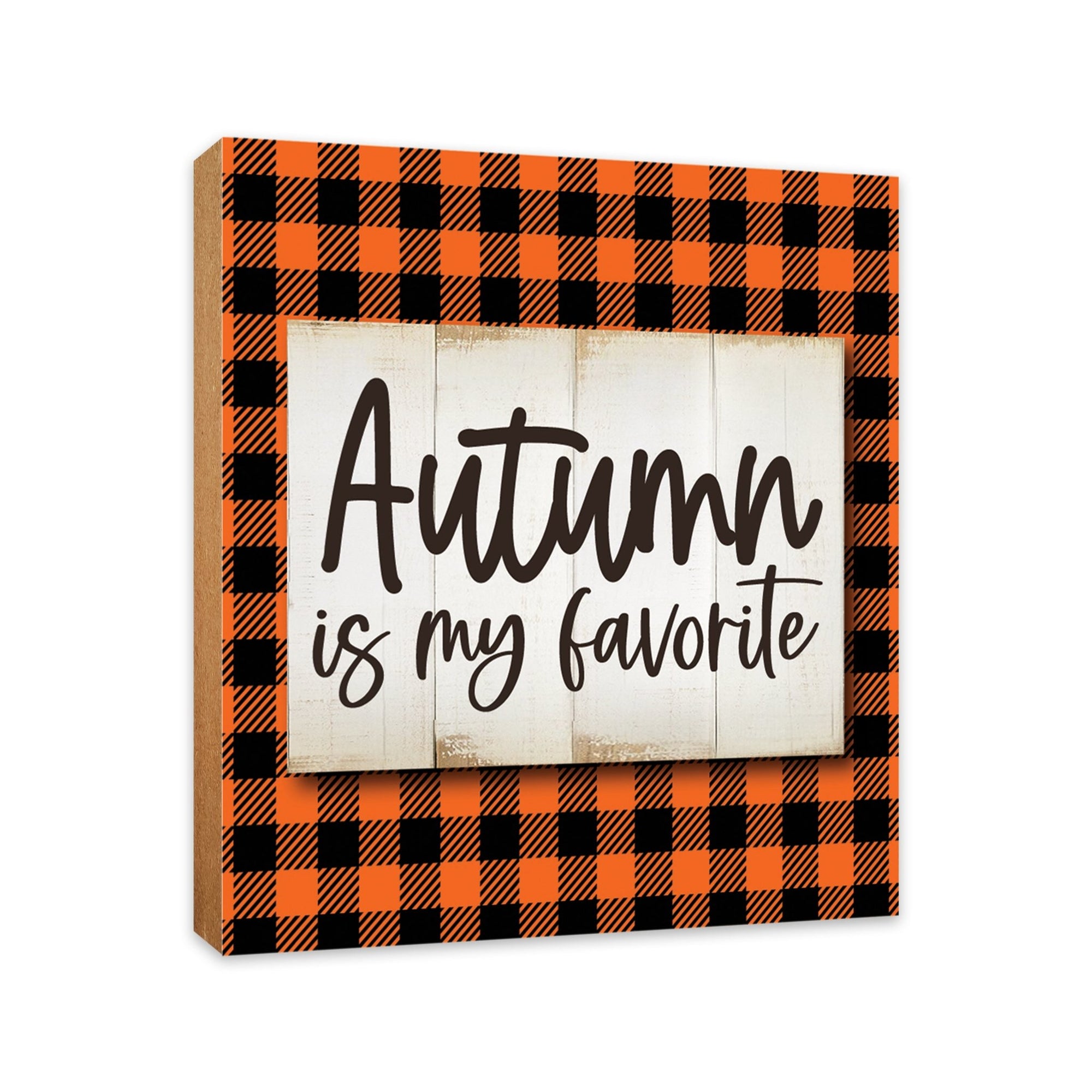 A close-up of a wooden tabletop adorned with inspirational fall signs, enhancing your home decor