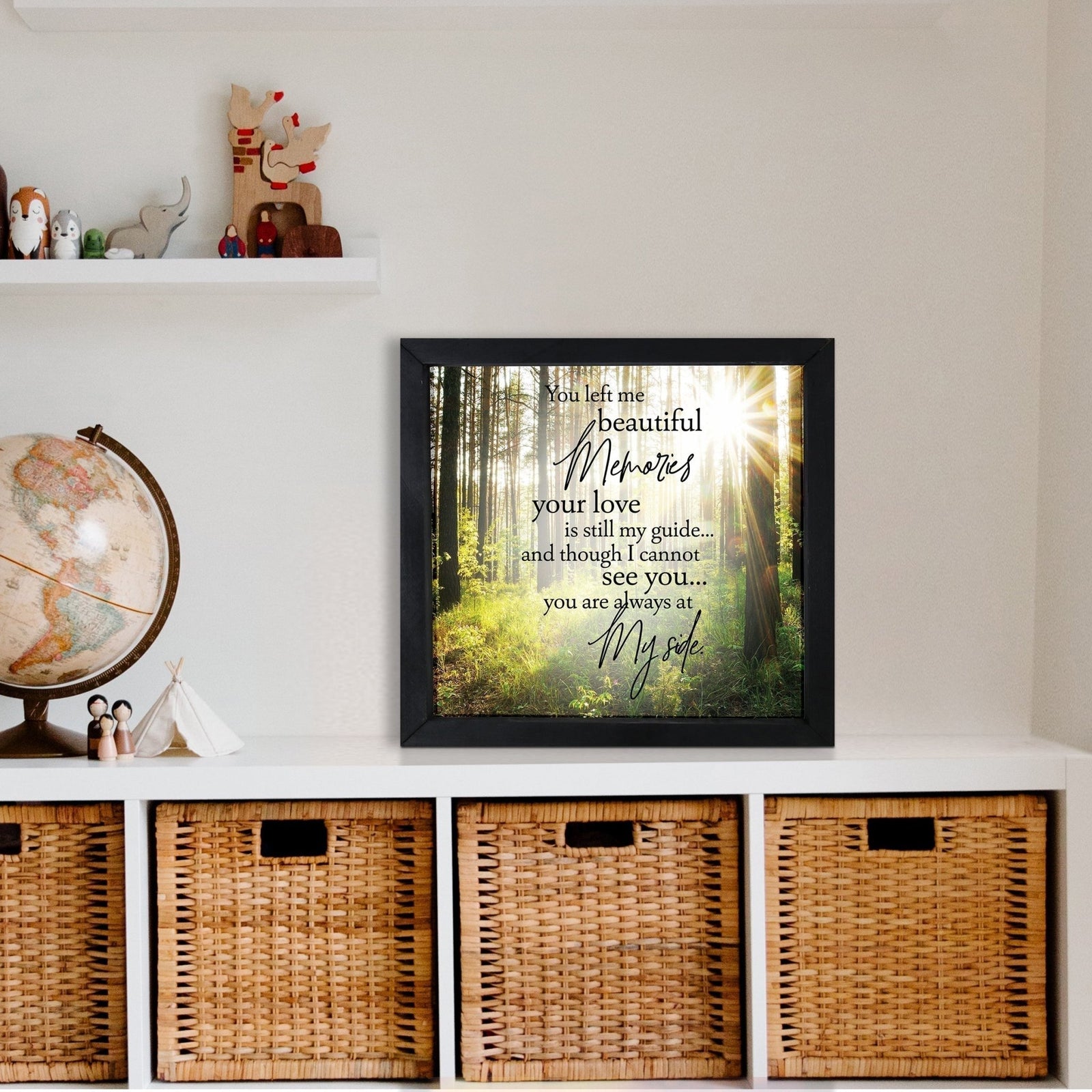 A framed shadow box with a heartfelt memorial tribute inside