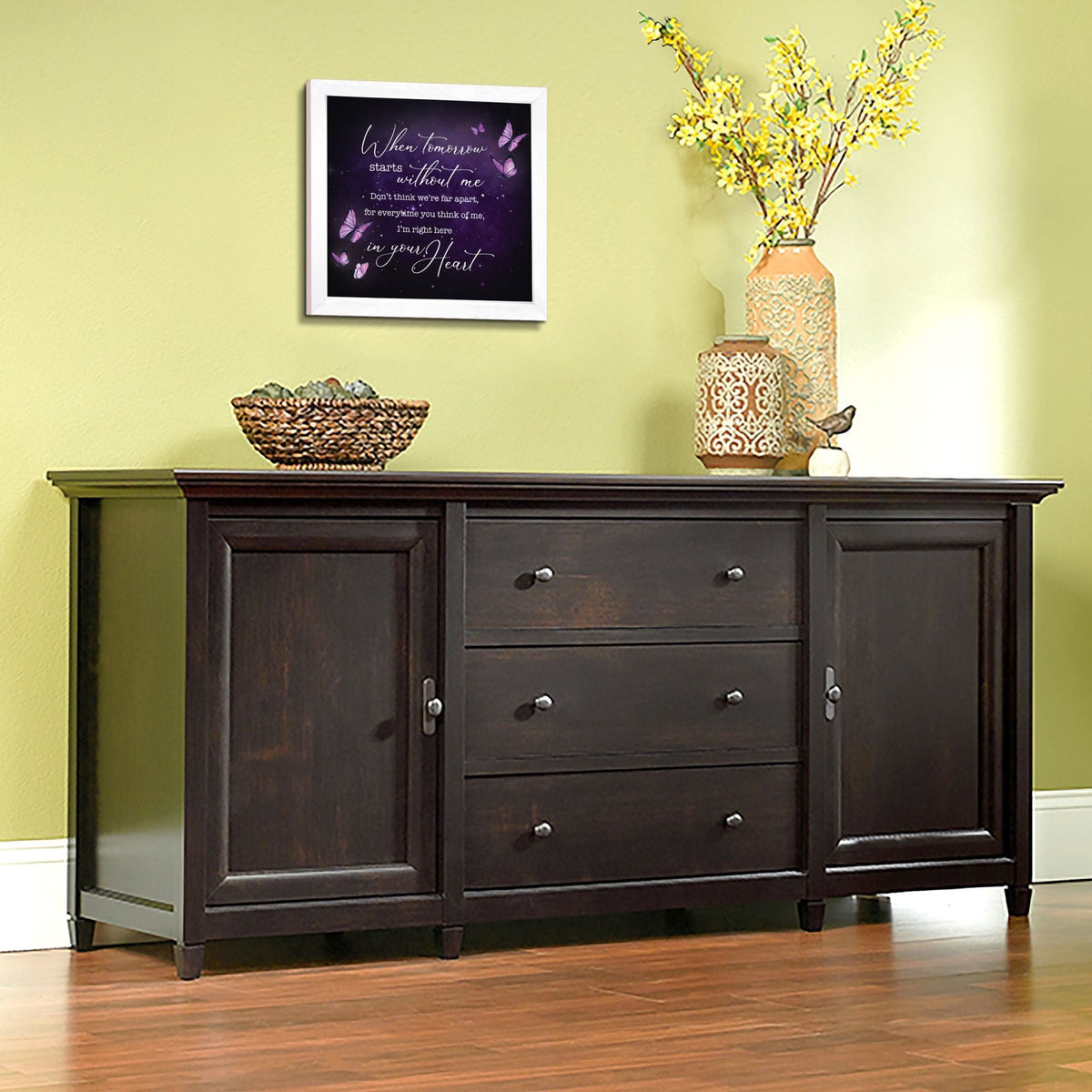 A framed shadow box with a heartfelt memorial tribute inside