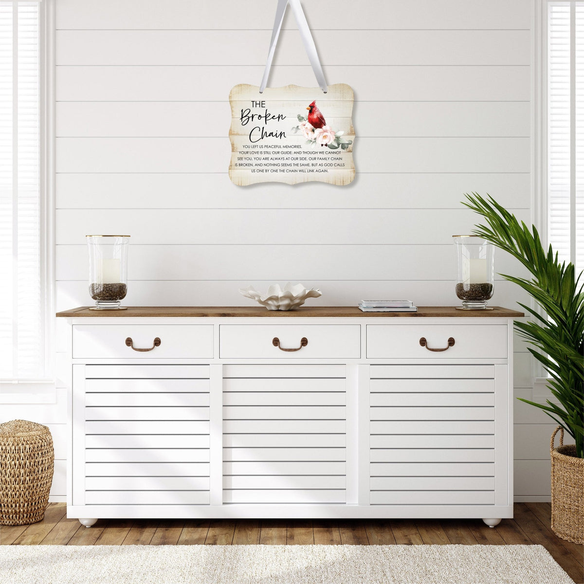 A memorial wall hanging sign adorned with a cardinal ribbon, a symbol of remembrance.