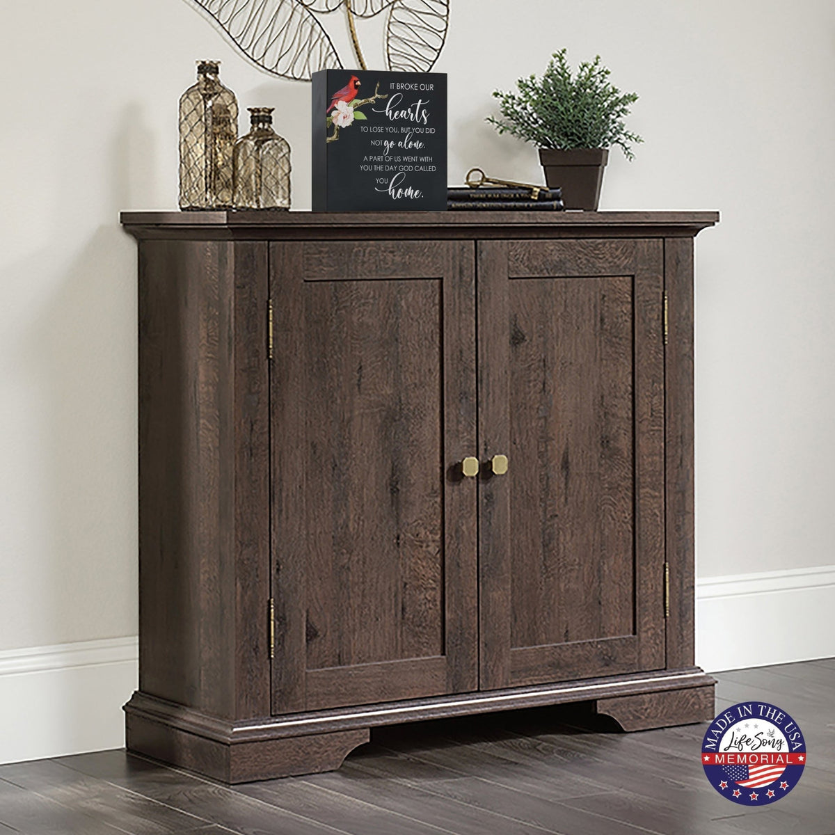 A wooden cremation urn box with a decorative design, suitable for holding human ashes.