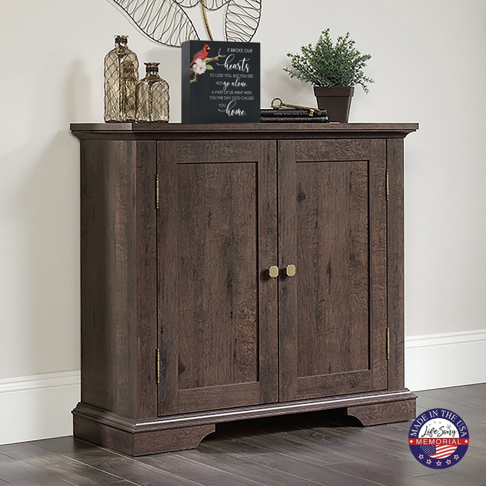 A wooden cremation urn box with a decorative design, suitable for holding human ashes.