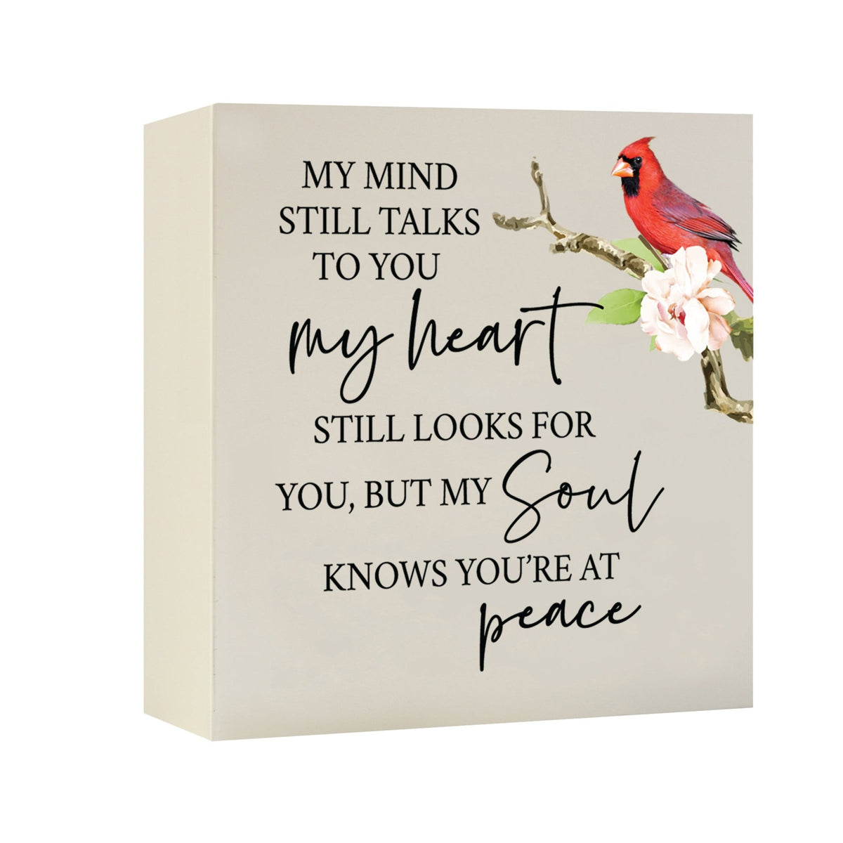 Close-up of a beautiful wooden shadow box urn for human ashes, accented with a red cardinal and white flowers. This adult memorial urn is both a heartfelt tribute and a decorative piece.