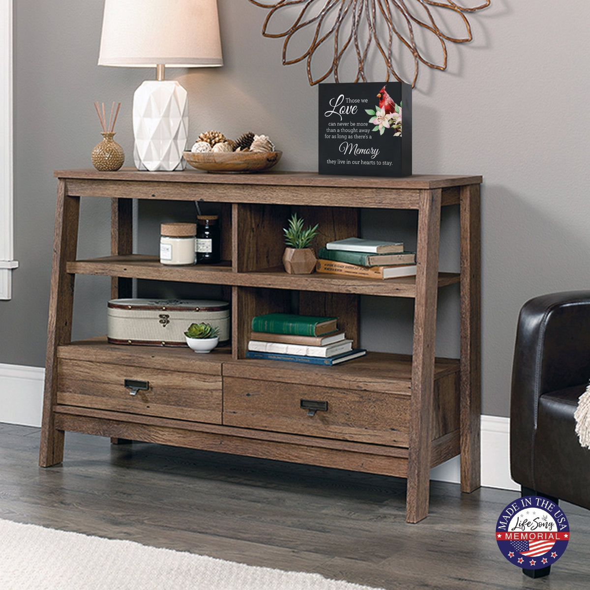 A wooden cremation urn box with a decorative design, suitable for holding human ashes.