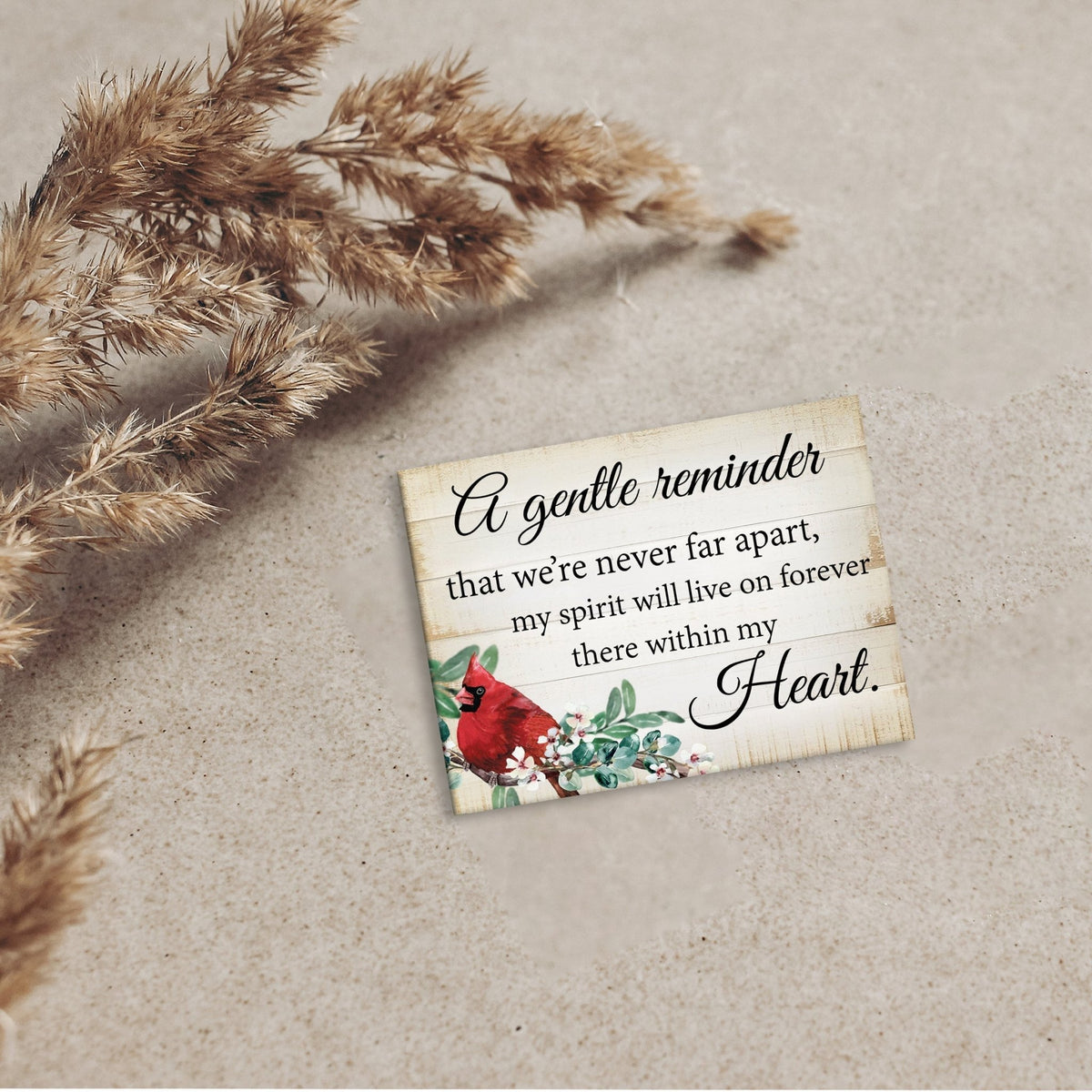A cardinal magnet that serves as a lasting memorial decoration, offering comfort and solace.