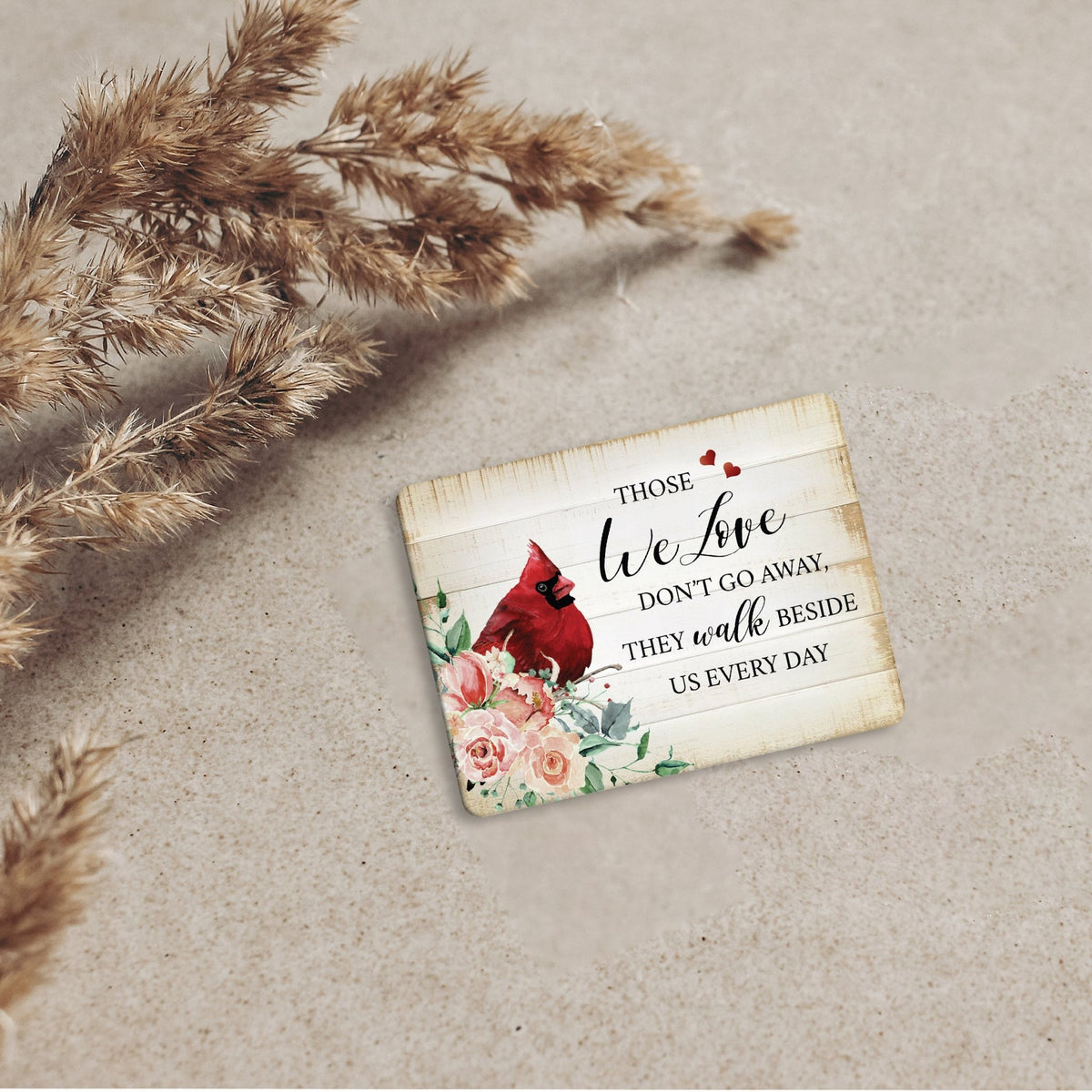 A cardinal magnet with a modern design, a heartfelt memorial home decoration.